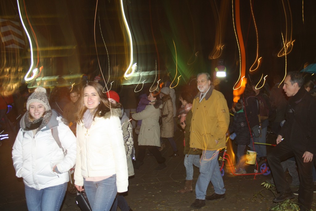 St. Martin`s day - Kate (l.) and Liza (r.) with conference particpiants on lantern walk Lichtermeer