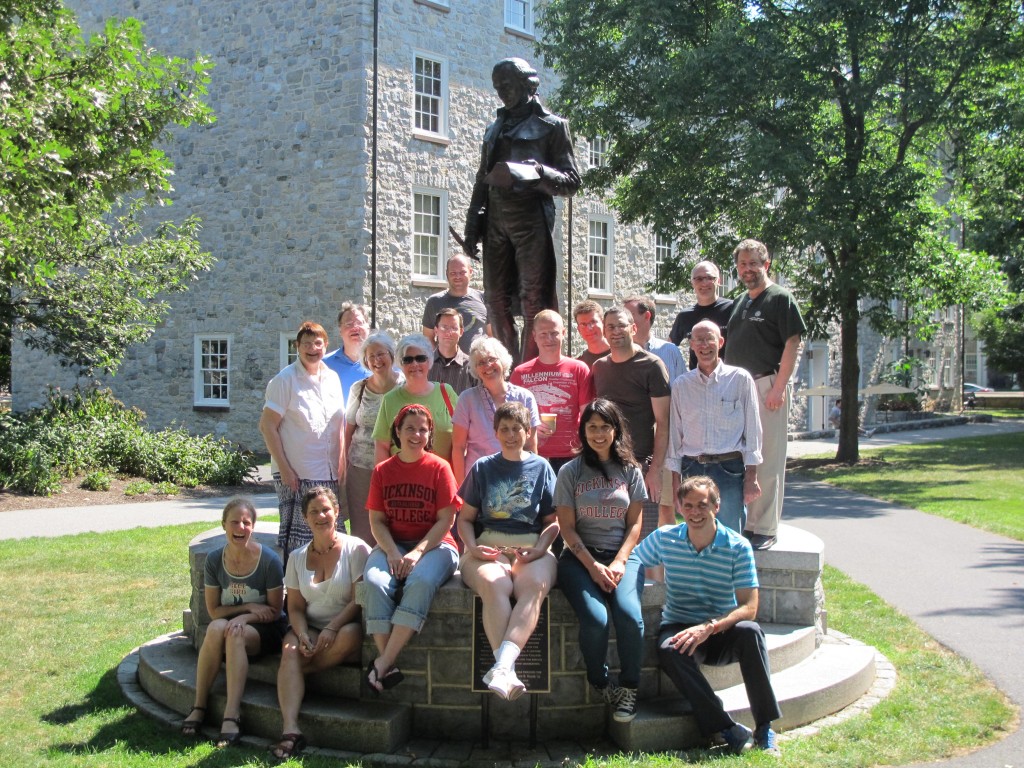 20 Latin teachers surrounding the statue of Benjamin Rush on the campus of Dickinson College