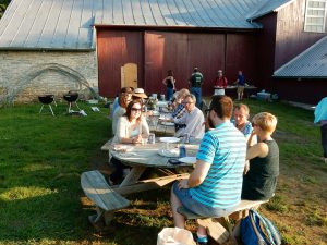Conventiculum participants enjoying dinner at the Dickinson Organic Farm