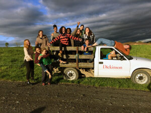 Dickinson farm student workers posing for a picture in a farm truck