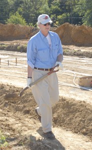 President Durden volunteered to help dig at the farm.
