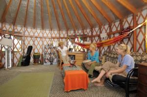Dickinson Farm Interns and student workers relax inside one of their yurts.