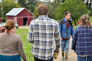 Scott Hoffman '12 gives a farm tour in 2011.