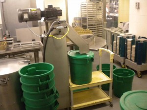 Dickinson Dining Hall's food pulper packs food waste into green bins.