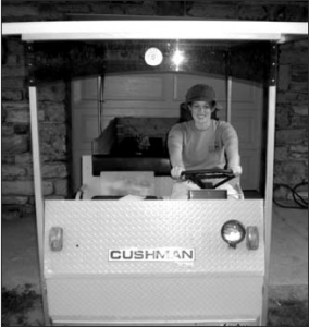 Kerry Snyder tries out the Solar Wheeler at Dickinson Farm.