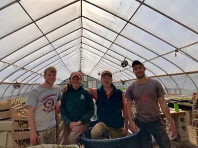 Rob (far left) with Madison Beehler '15 (left) and Brendan Murtha '14 (far right) at The Food Project