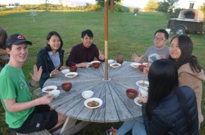 Everyone sit down to eat yummy Japanese food that they made by themselves. 