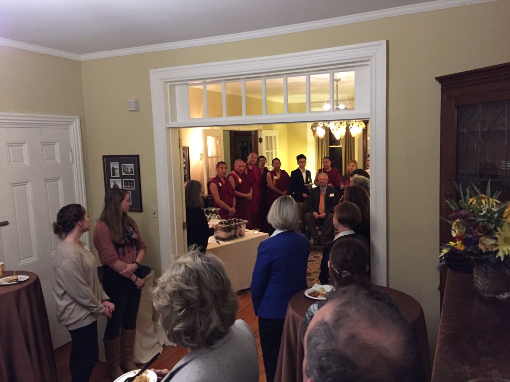 Director of the Clark Forum and Prof. of American Studies Amy Farrell welcomes the monks to a reception with students, staff, and faculty.