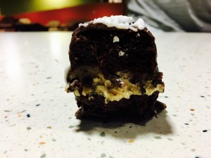 We made cookie dough in between two brownie bites, covered in chocolate. 