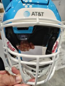 Football helmet with screen for deaf players to see the play call.