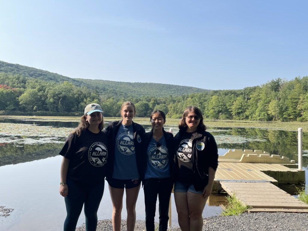 Group photo in front of Laurel Lake