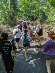 Image shows CONNECT campers and ALLARM students walking along the LeTort