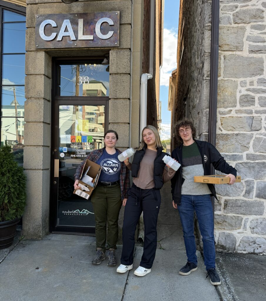 Marja, Amelia and Crosby pose for a photo outside of the CALC building