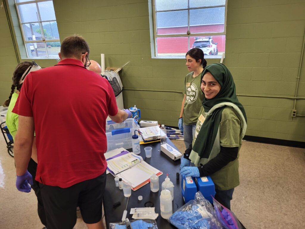 Hakeema and Anna training volunteers on how to use the Stream Team kits on Saturday.