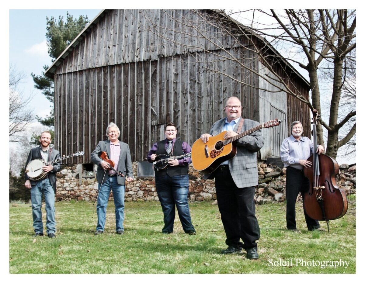 Image of the danny paisley band in front of a barn