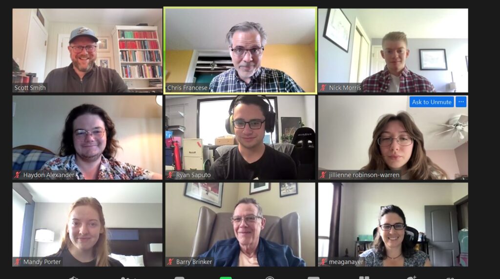 nine people in separate boxes on a Zoom call