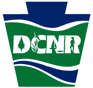 DCNR Logo - DCNR is written within a blue and green keystone