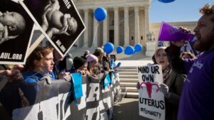 Anti-abortion and pro-choice protestors clash