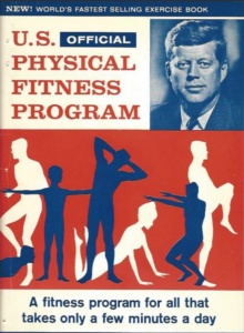 Red white and blue fitness pamphlet with a photo of JFK on the front to detail and demonstrate exercises to keep Americans fit. 