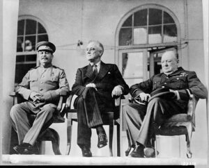 Stalin, Roosevelt, and Churchill seated outside the Russian Embassy in Tehran, Iran – 1943