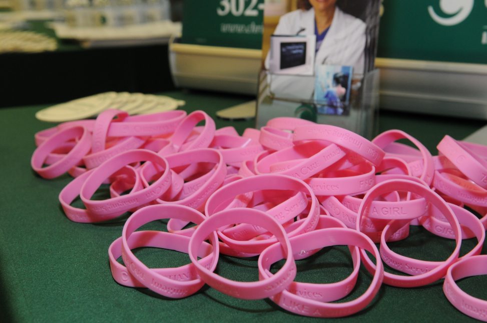 pile of breast cancer awareness bracelets